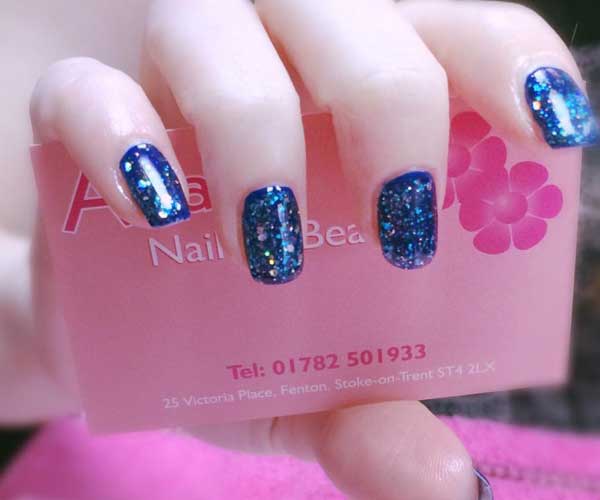 Blue glitter nail polish